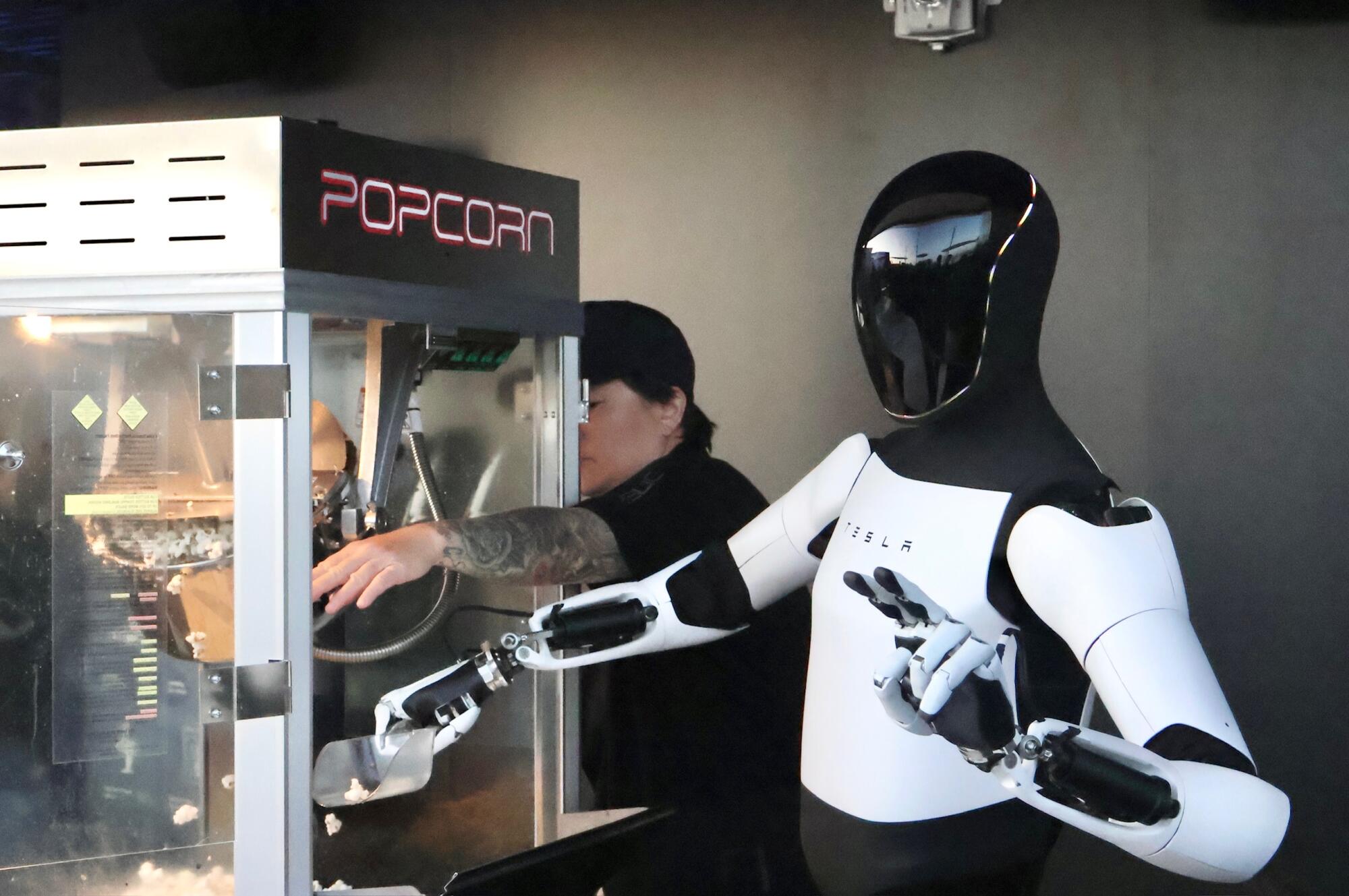 Optimus robot serving popcorn at the Tesla Diner.