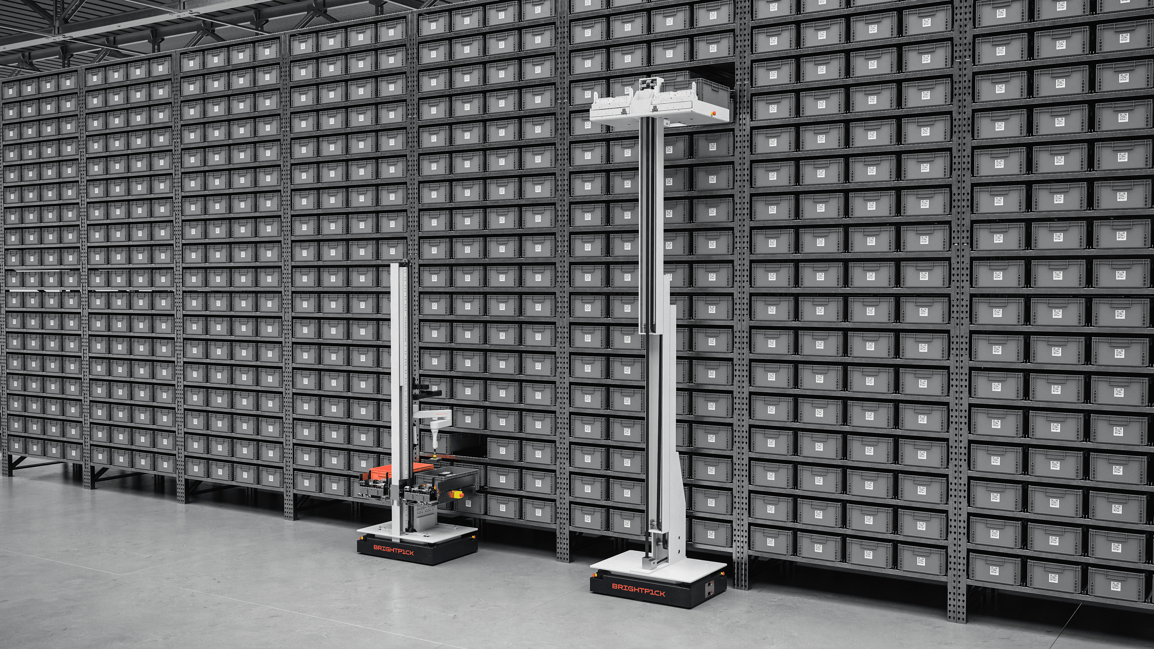 Autopicker performing a pick while Giraffe assists with higher storage levels.