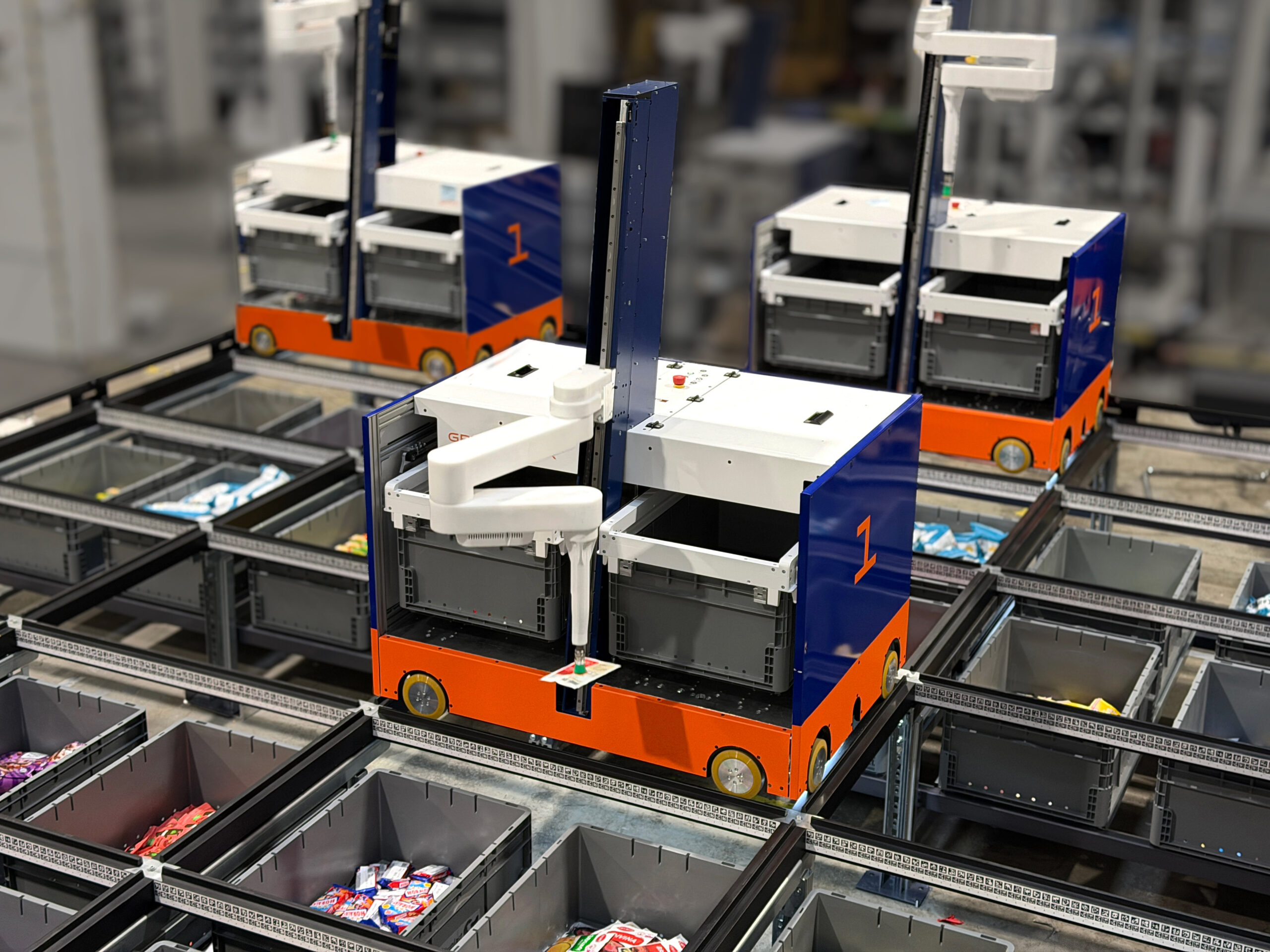 Brightpick Gridpicker retrieving and picking items directly from totes within its automated storage grid.
