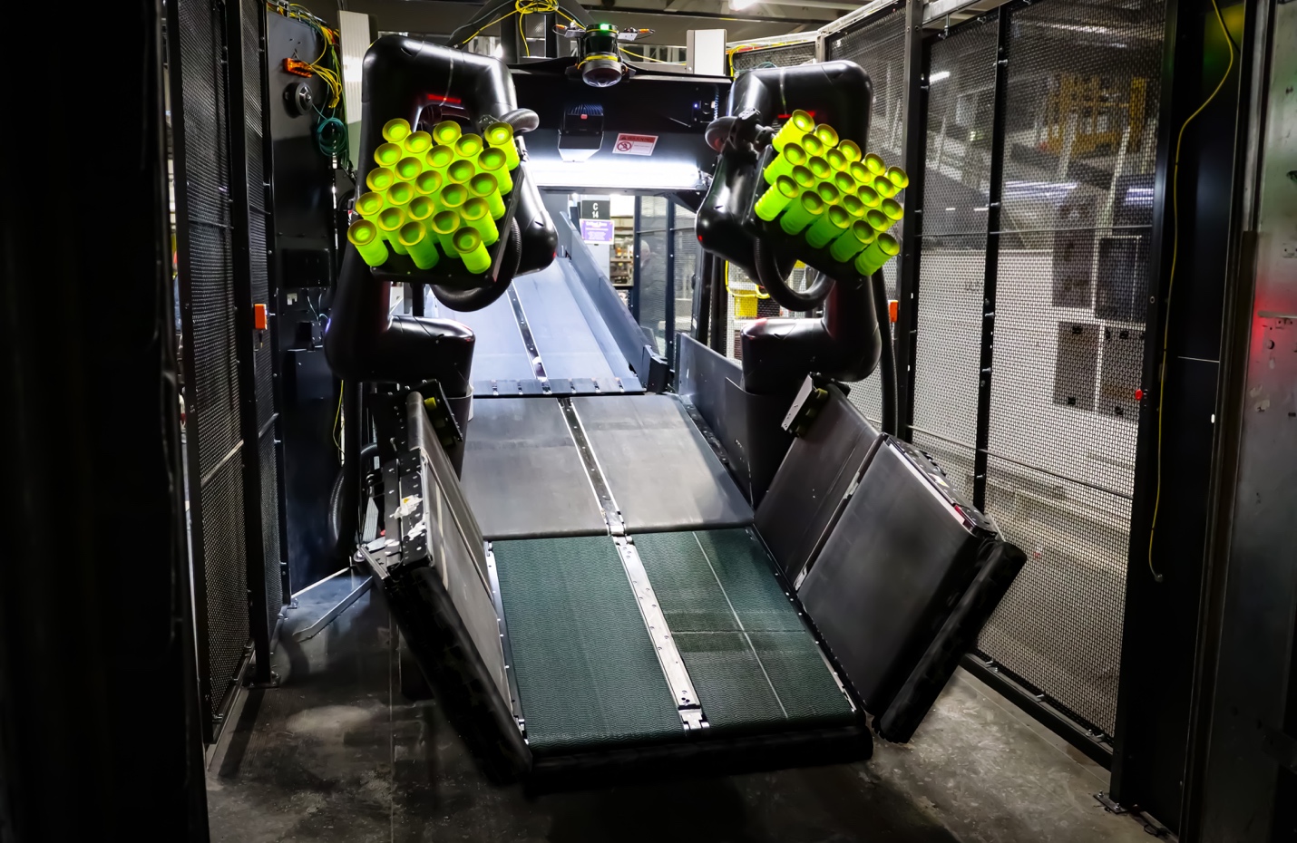 Scoop automates carton unloading from incoming freight trailers.