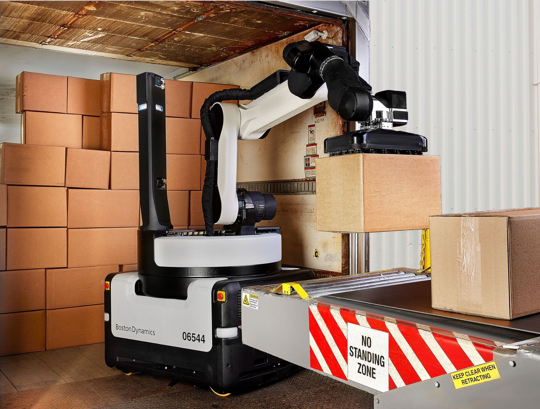 Boston Dynamics Stretch autonomously unloads cartons from shipping trailers.