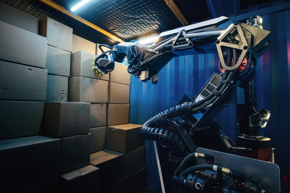 Advanced robotic vision and vacuum gripping enable precise package handling.