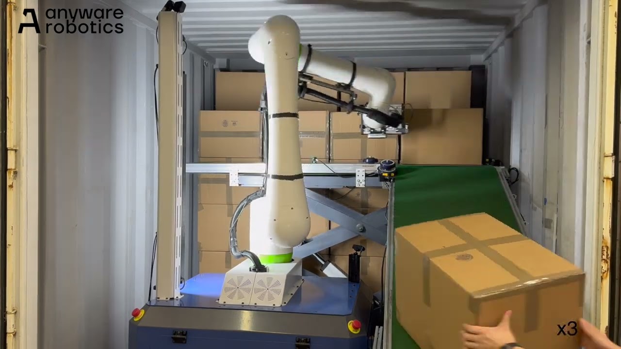 Anyware Robotics Pixmo unloading boxes inside a shipping trailer.