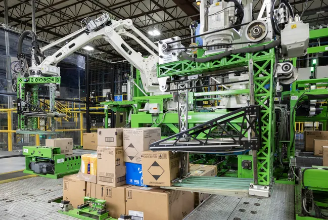 Symbotic robotic palletizing system for automated case handling and mixed-product pallet assembly.