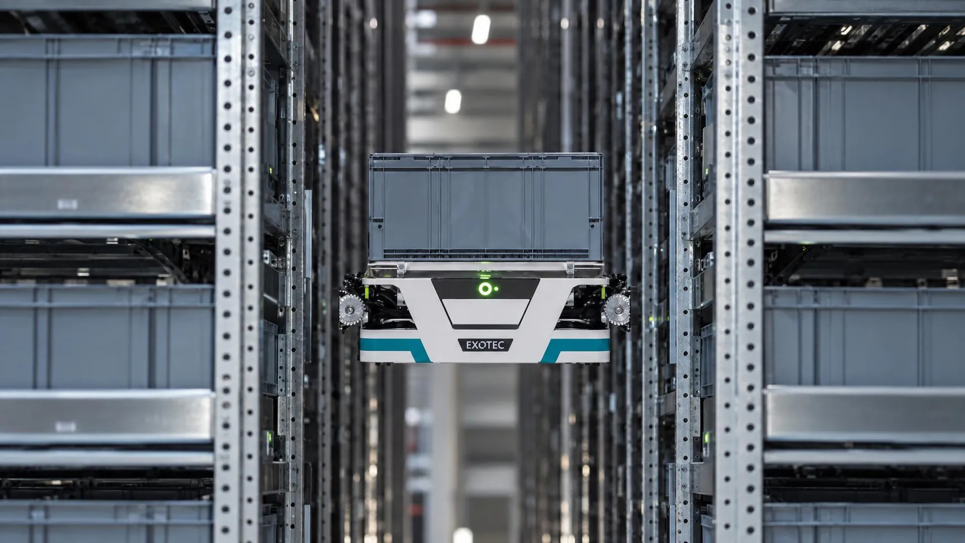 Exotec Skypod robot climbing vertical storage racks to access and retrieve inventory bins.